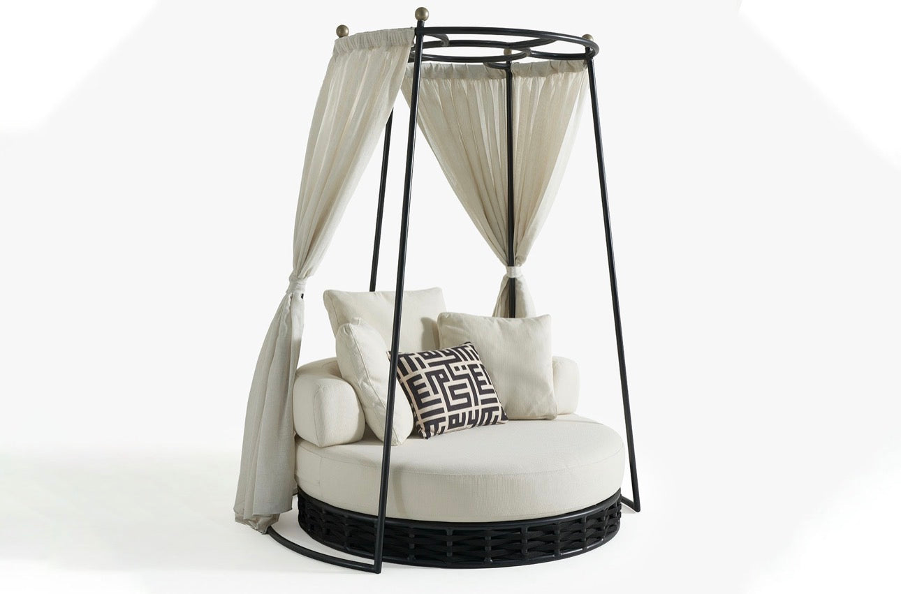 Sanctuarie luxury canopy lounge chair with draped fabric and deep cushioned seating