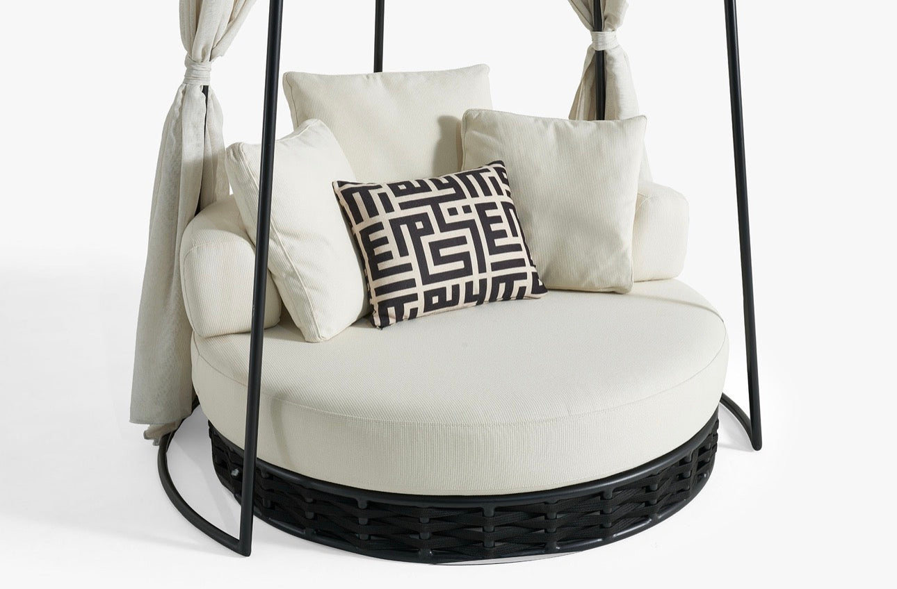 Sanctuarie luxury canopy lounge chair with draped fabric and deep cushioned seating