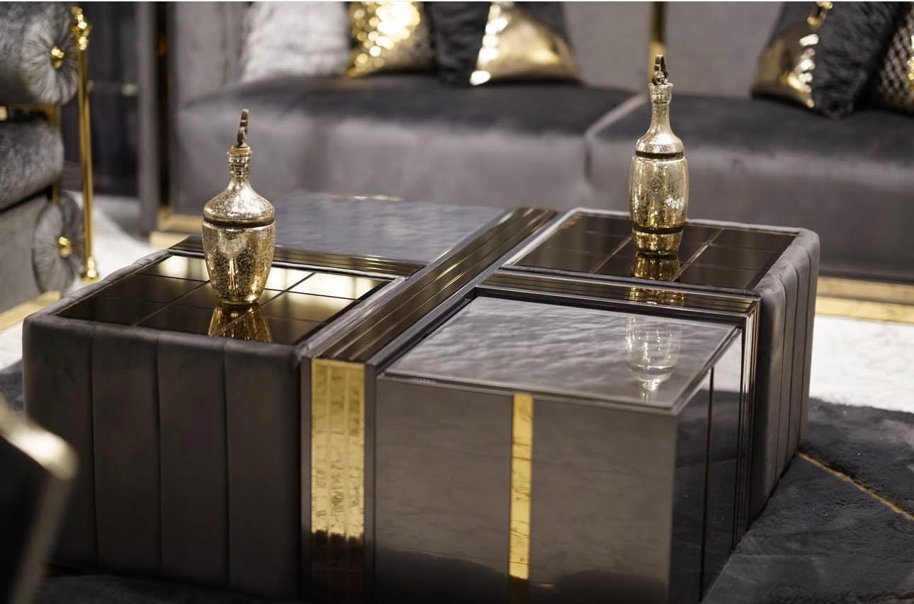 Frost luxury furniture collection featuring geometric wall mirror, dark lacquer sideboard with gold accents, and patterned armchairs with sculptural brass frames.