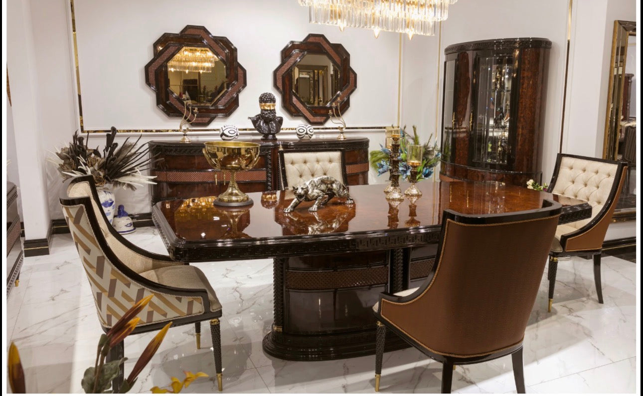 Valence luxury furniture collection with rich wood dining table, upholstered seating, and elegant living room pieces with gold accents.