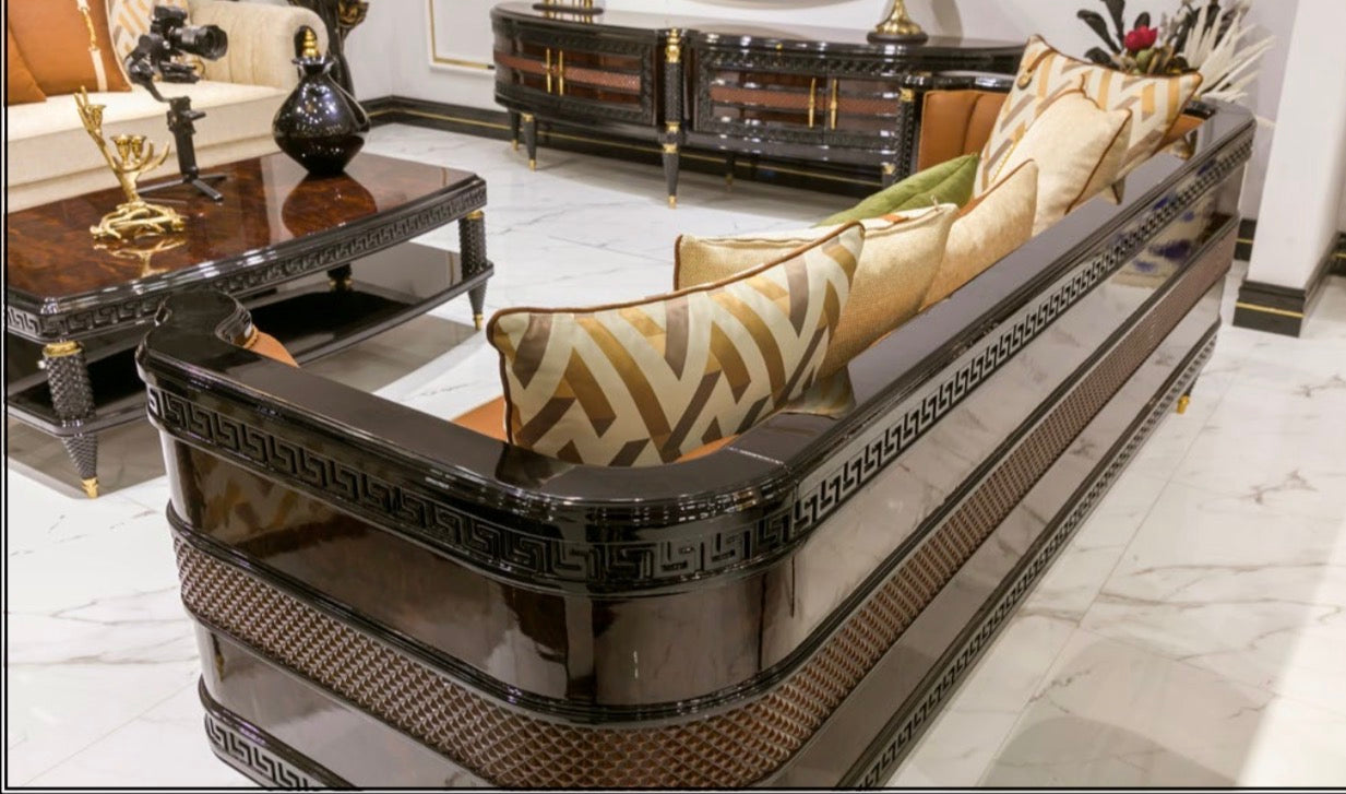 Valence luxury furniture collection with rich wood dining table, upholstered seating, and elegant living room pieces with gold accents.