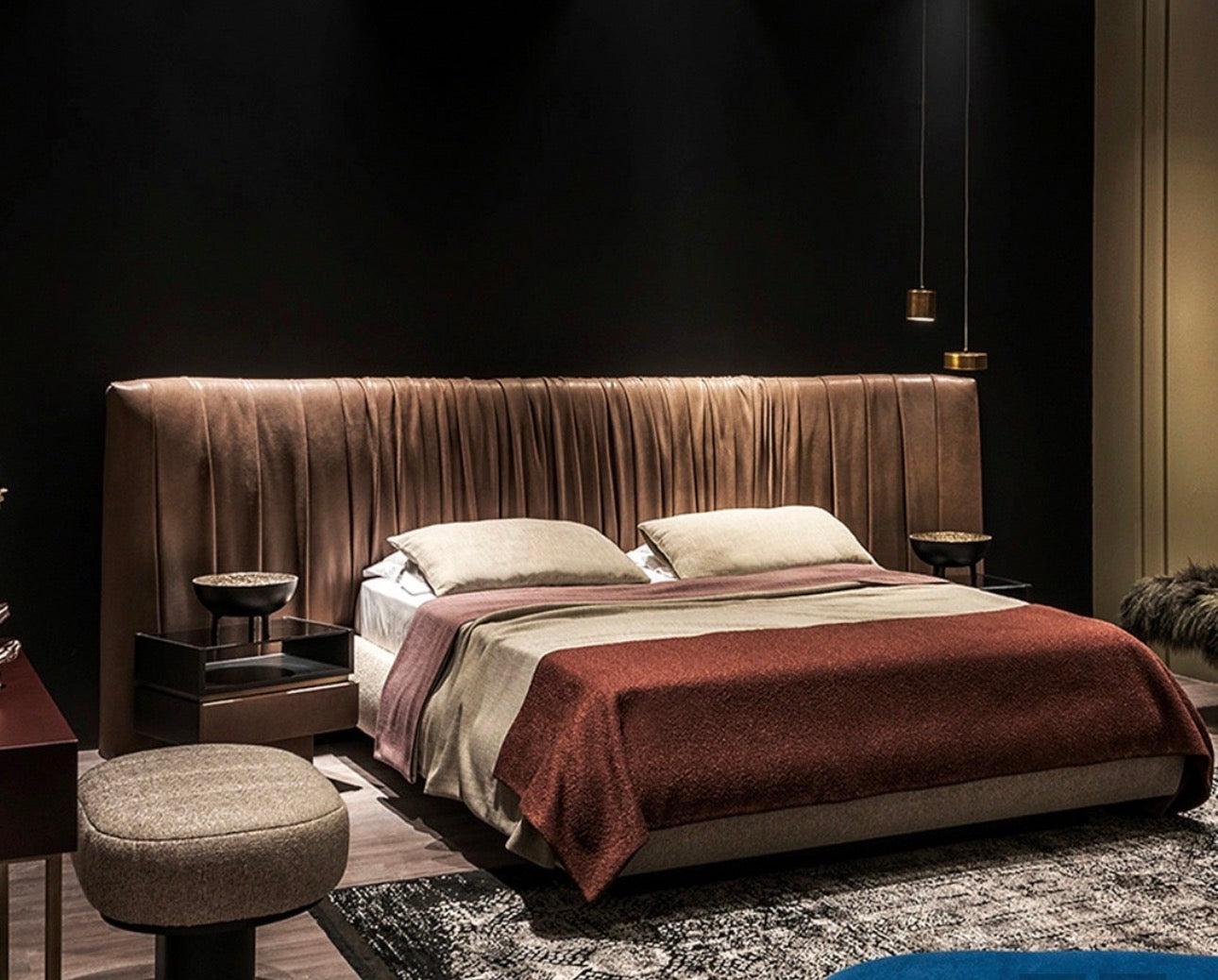 Margot luxury bedroom furniture collection with sculptural upholstered bed and modern bedside tables.