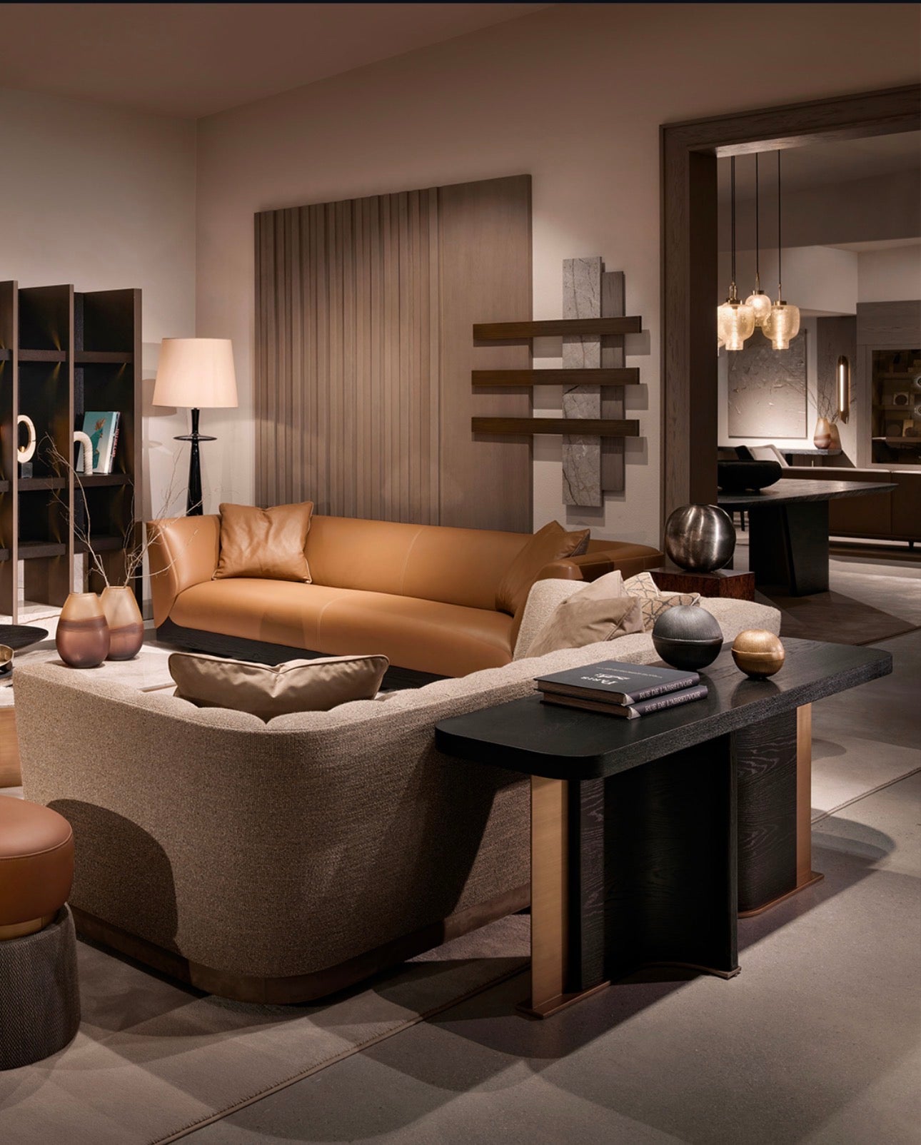 Equinox luxury living room furniture collection featuring modern leather sofa, sculptural lounge chairs, and contemporary shelving design.