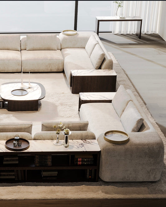 Olympus luxury furniture collection with modern dining table, sculptural seating, and marble accent tables.