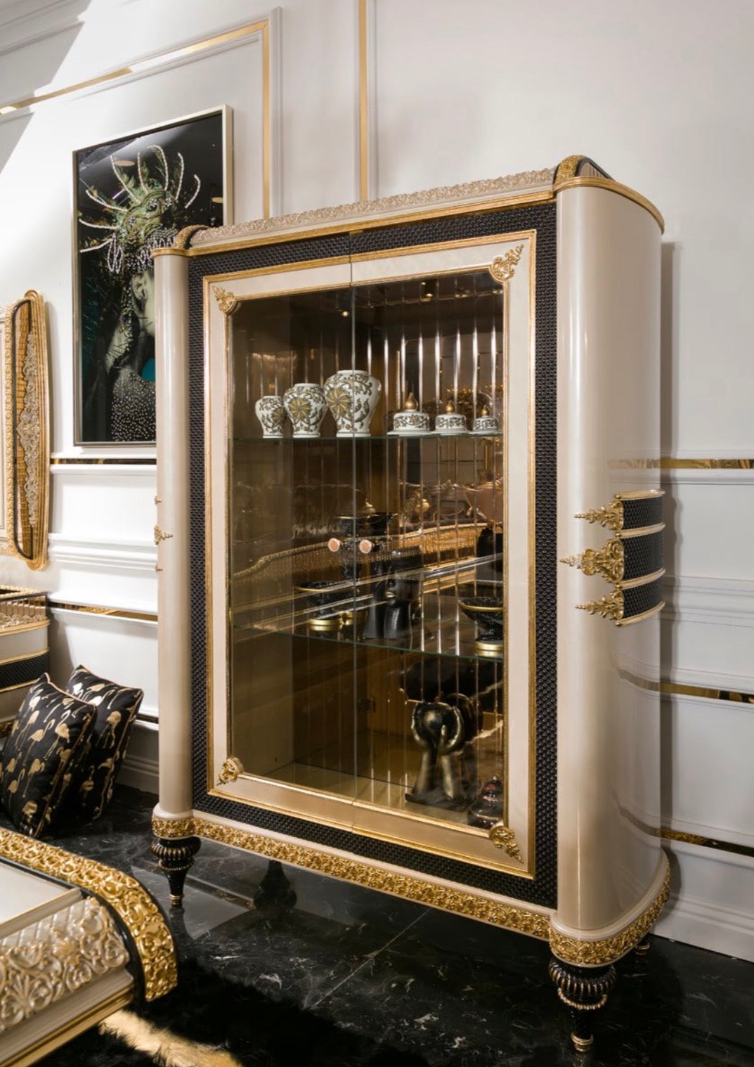 Regalia luxury furniture collection featuring ornate gold living room seating and classic dining set with intricate detailing and black marble flooring.