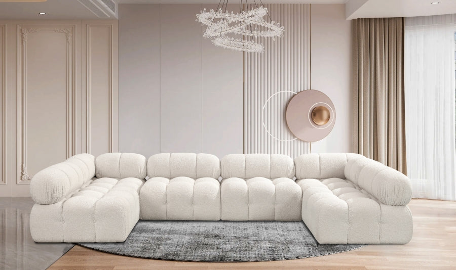 Fancci Stonecrest Atelier deep tufted modular sectional sofa with oversized design in a modern luxury living space.