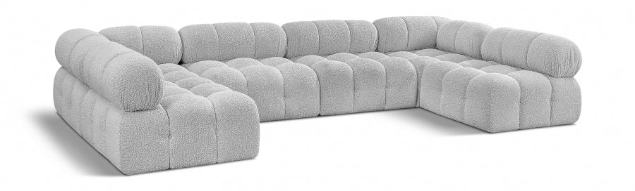 Fancci Stonecrest Atelier deep tufted modular sectional sofa with oversized design in a modern luxury living space.
