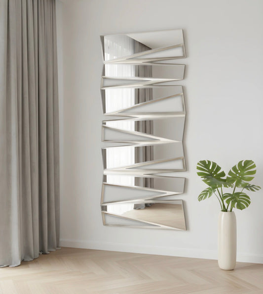 Fancci Jazzy vertical geometric wall mirror with layered angular panels in a modern luxury interior setting.