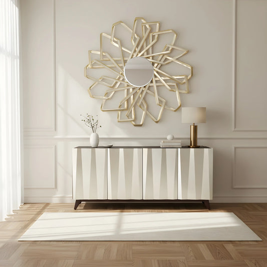 Velric geometric gold wall mirror with angular sculptural design styled above a modern console in a luxury interior. Fancci Boutique