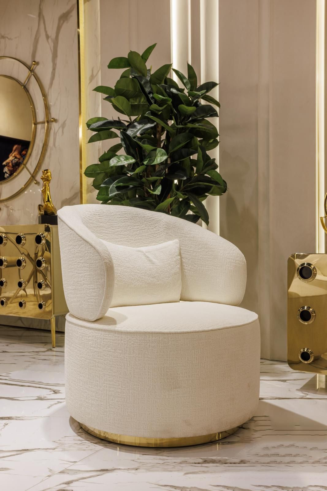 Ivory luxury furniture collection with gold sideboard, marble walls, white seating, and modern high-end living and dining design.